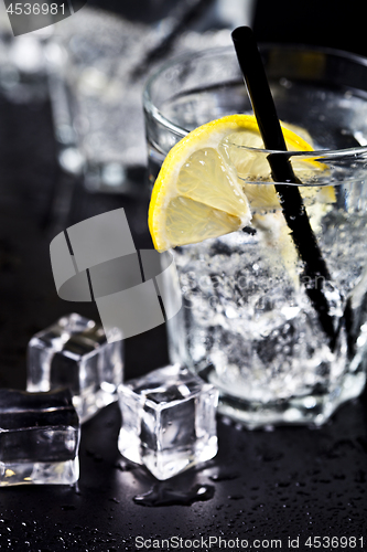 Image of Glasses with fresh cold carbonated water with lemon slices and i