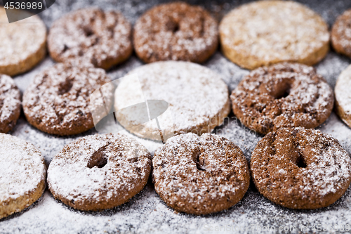 Image of Chocolate chip and oat fresh cookies with sugar powder closeup