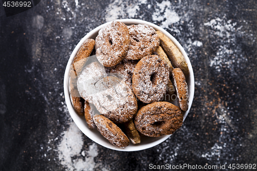 Image of Fresh baked chocolate chip and oat fresh cookies with sugar powd