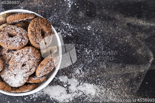 Image of Fresh baked chocolate chip and oat fresh cookies with sugar powd