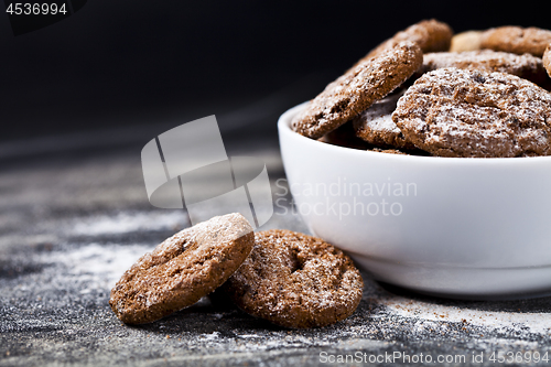 Image of Fresh baked chocolate chip and oat fresh cookies with sugar powd