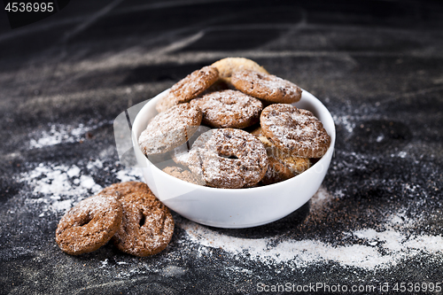 Image of Fresh baked chocolate chip and oat fresh cookies with sugar powd