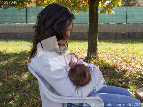 Image of Woman breastfeeding baby