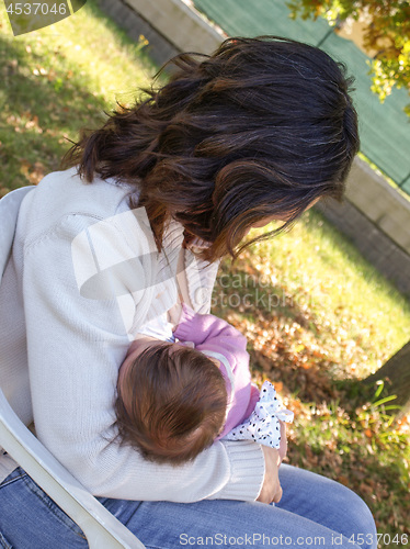 Image of Woman breastfeeding baby