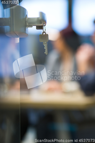 Image of Open  glass door with keys