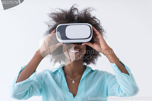 Image of black girl using VR headset glasses of virtual reality