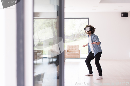 Image of man using VR-headset glasses of virtual reality