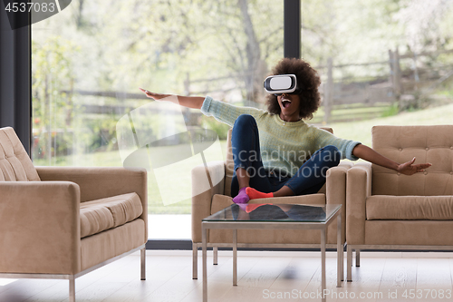 Image of black woman using VR headset glasses of virtual reality