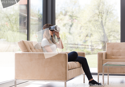 Image of woman using VR-headset glasses of virtual reality