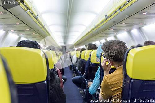 Image of Interior of commercial airplane during flight.