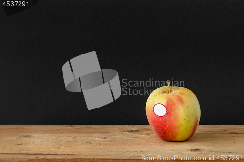 Image of black background apple wooden table