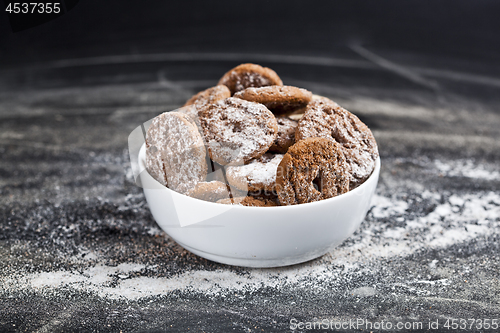 Image of Fresh baked chocolate chip and oat fresh cookies with sugar powd