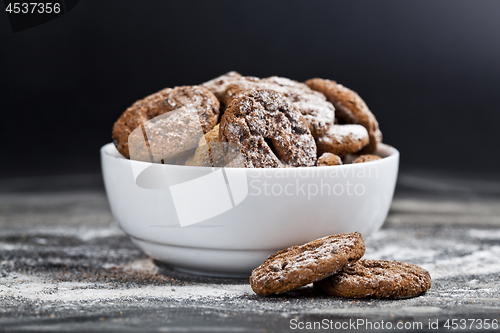 Image of Fresh baked chocolate chip and oat fresh cookies with sugar powd