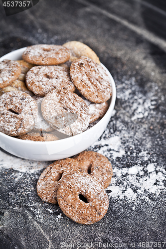 Image of Fresh baked chocolate chip and oat fresh cookies with sugar powd