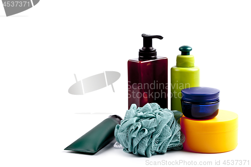 Image of Bath cosmetic products and sponge on white background. 