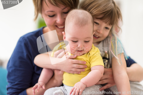 Image of portrait of young mother with  her kids