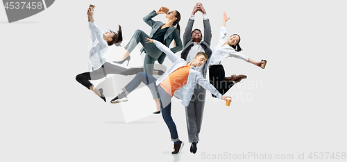 Image of Office workers or ballet dancers jumping on white background