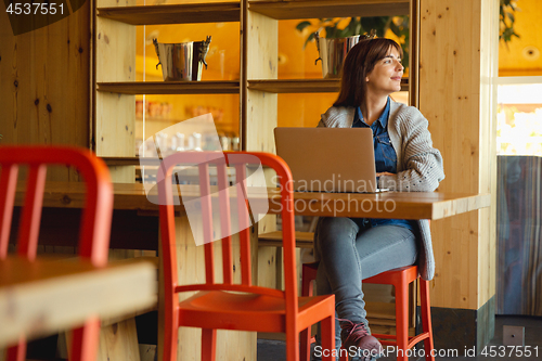 Image of Woman working on a laptop 