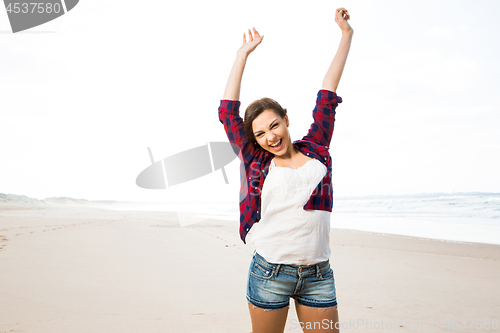 Image of Girl having\r fun on the beach 