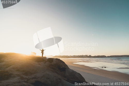 Image of Woman over the cliff