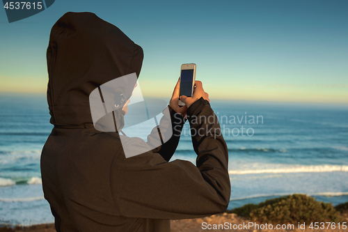 Image of Girl taking a picture