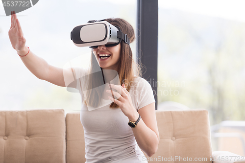 Image of woman using VR-headset glasses of virtual reality