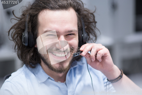 Image of male call centre operator doing his job