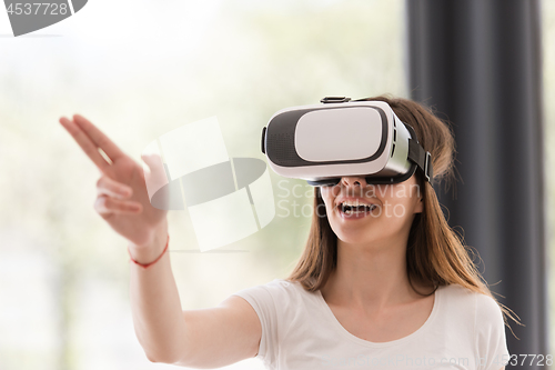 Image of woman using VR-headset glasses of virtual reality