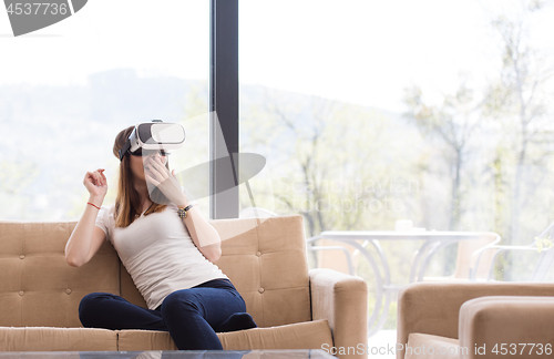 Image of woman using VR-headset glasses of virtual reality