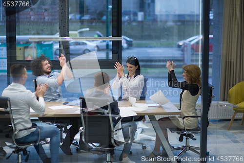 Image of startup Group of young business people celebrating success