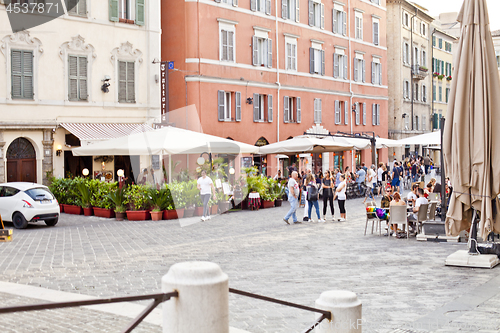 Image of Ancona, Italy - June 8 2019: People enjoying summer day and food