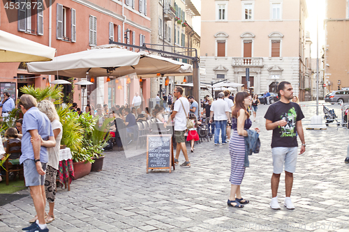 Image of Ancona, Italy - June 8 2019: People enjoying summer day and food