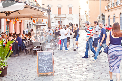 Image of Ancona, Italy - June 8 2019: People enjoying summer day and food