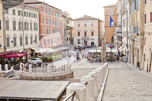 Image of Ancona, Italy - June 8 2019: People enjoying summer day and food
