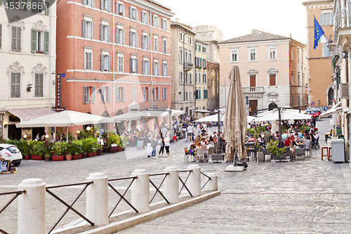 Image of Ancona, Italy - June 8 2019: People enjoying summer day and food