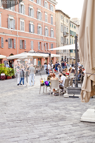 Image of Ancona, Italy - June 8 2019: People enjoying summer day and food