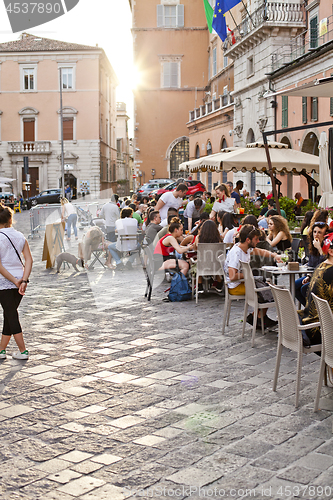 Image of Ancona, Italy - June 8 2019: People enjoying summer day and food