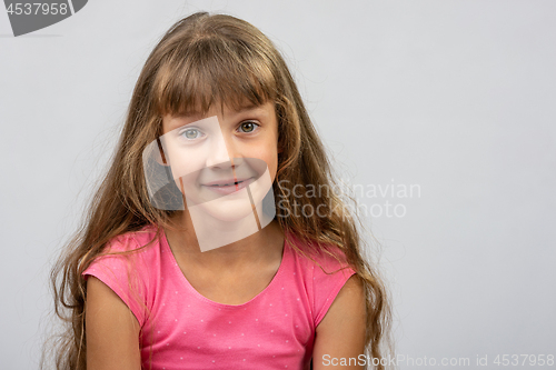 Image of Portrait of a surprised beautiful eight-year cheerful European girl