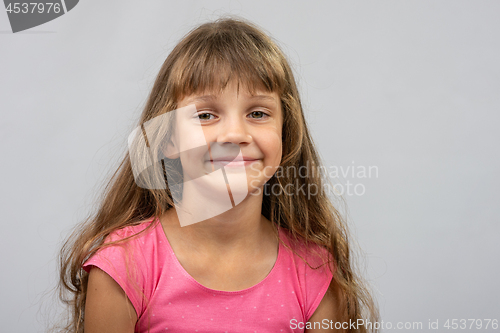 Image of Portrait of a beautiful eight year old cheerful Europeans girl