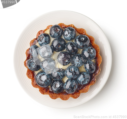 Image of blueberry tart on white plate