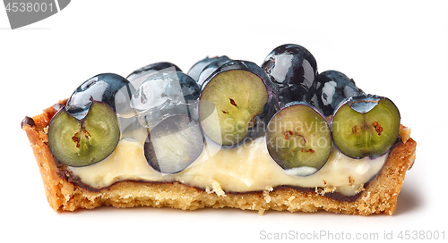 Image of half of blueberry tart on white background