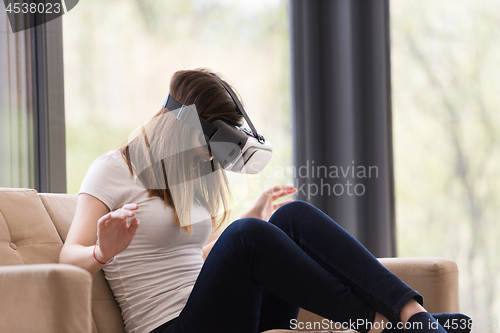 Image of woman using VR-headset glasses of virtual reality