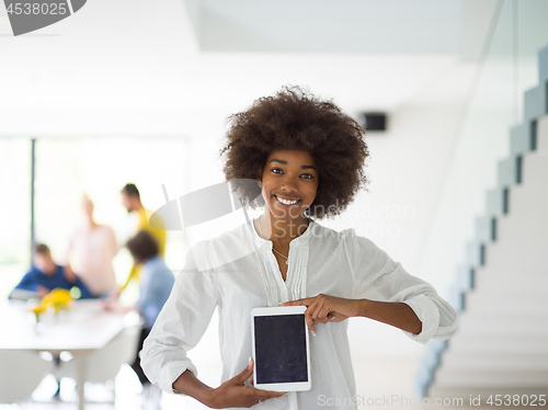 Image of Portrait of  black casual businesswoman using tablet  with cowor