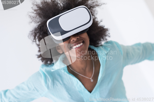 Image of black girl using VR headset glasses of virtual reality