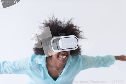 Image of black girl using VR headset glasses of virtual reality