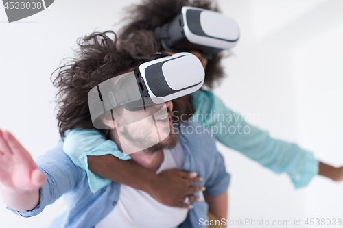 Image of multiethnic couple getting experience using VR headset glasses