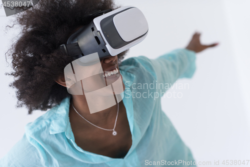 Image of black girl using VR headset glasses of virtual reality
