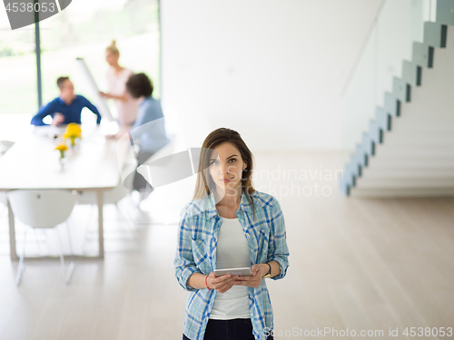 Image of Portrait of  smiling casual businesswoman using tablet  with cow