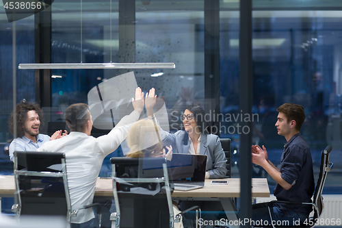 Image of startup Group of young business people celebrating success