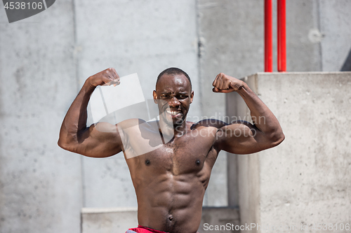 Image of Athlete doing exercises at stadium